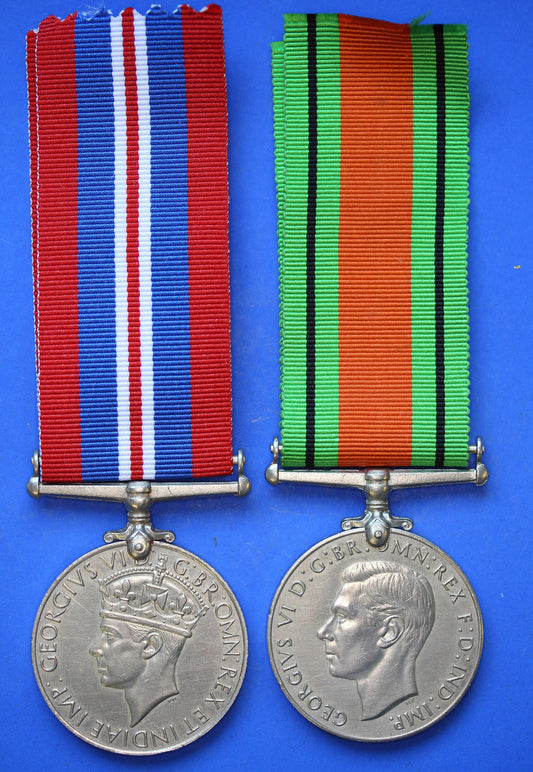 Pair of WW2 medals - George VI Defence and War medals with ribbons      [R04/25 29979]