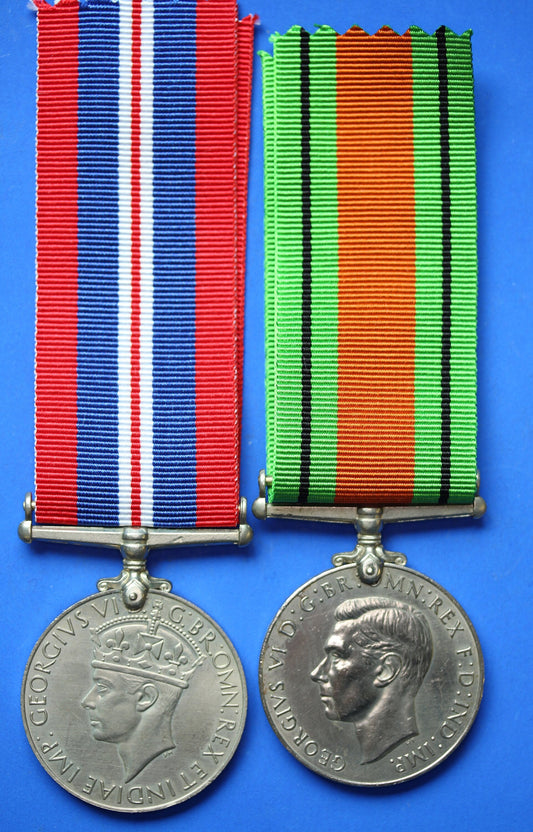 Pair of WW2 medals - George VI Defence and War medals with ribbons      [R04/25 29981]