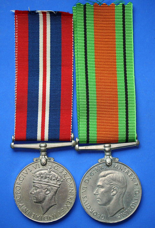 Pair of WW2 medals - George VI Defence and War medals with ribbons      [R04/25 29980]