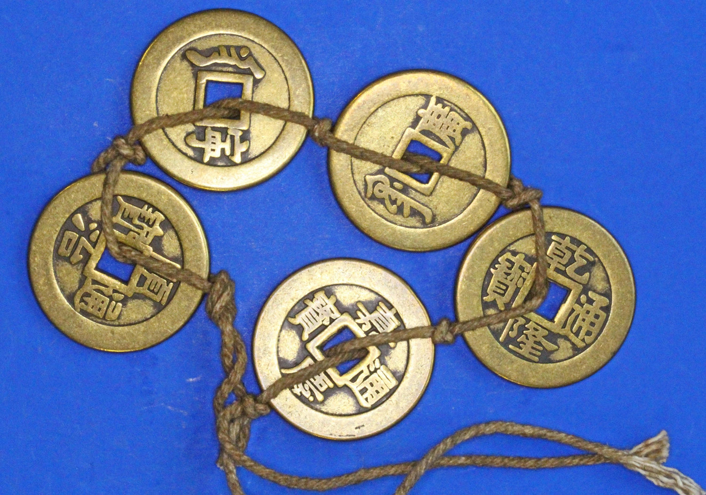 A string Chinese Feng Shui brass coins, "Five Emperors" set, 25mm   [12/25 33901]