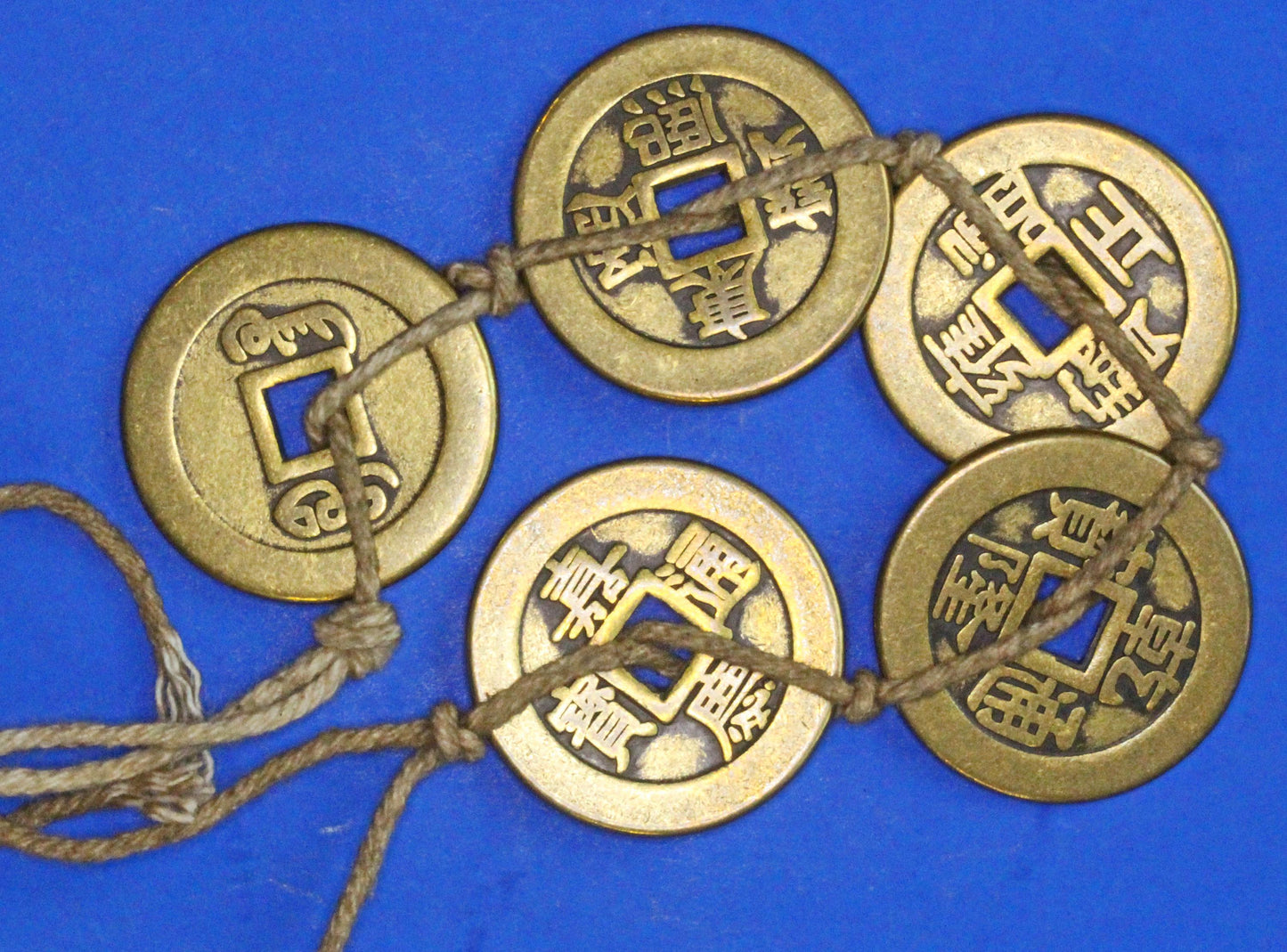 A string Chinese Feng Shui brass coins, "Five Emperors" set, 25mm   [12/25 33902]