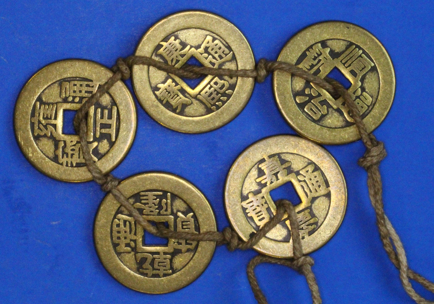 A string Chinese Feng Shui brass coins, "Five Emperors" set, 25mm   [12/25 33904]